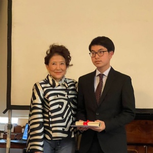 Year 12 student Lewis with Jung Chang collecting essay writing prize